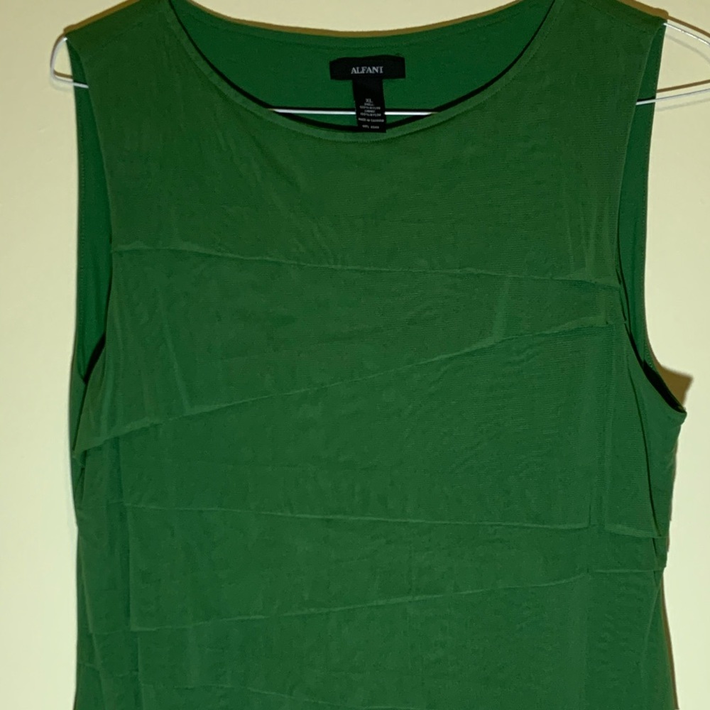 Sleeveless green nylon shirt. Great for work
